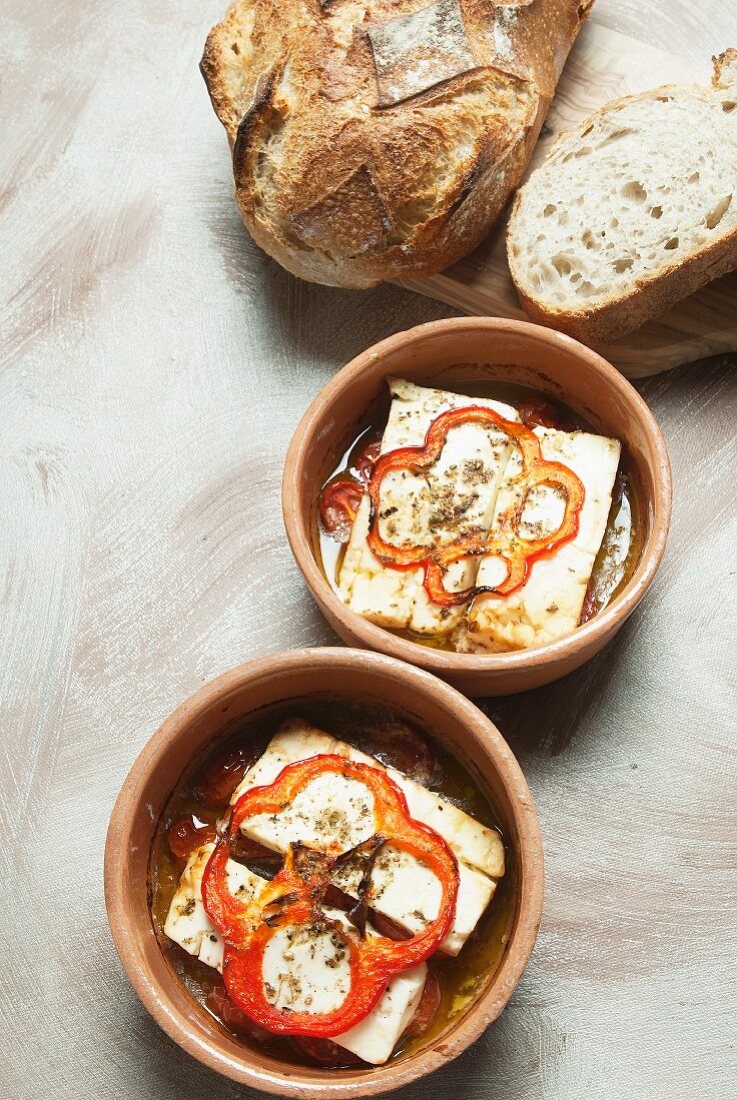 Oven-roasted feta cheese with tomatoes, peppers and olive oil