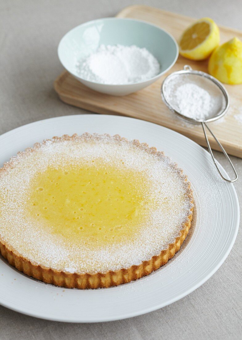 Lemon tart dusted with icing sugar