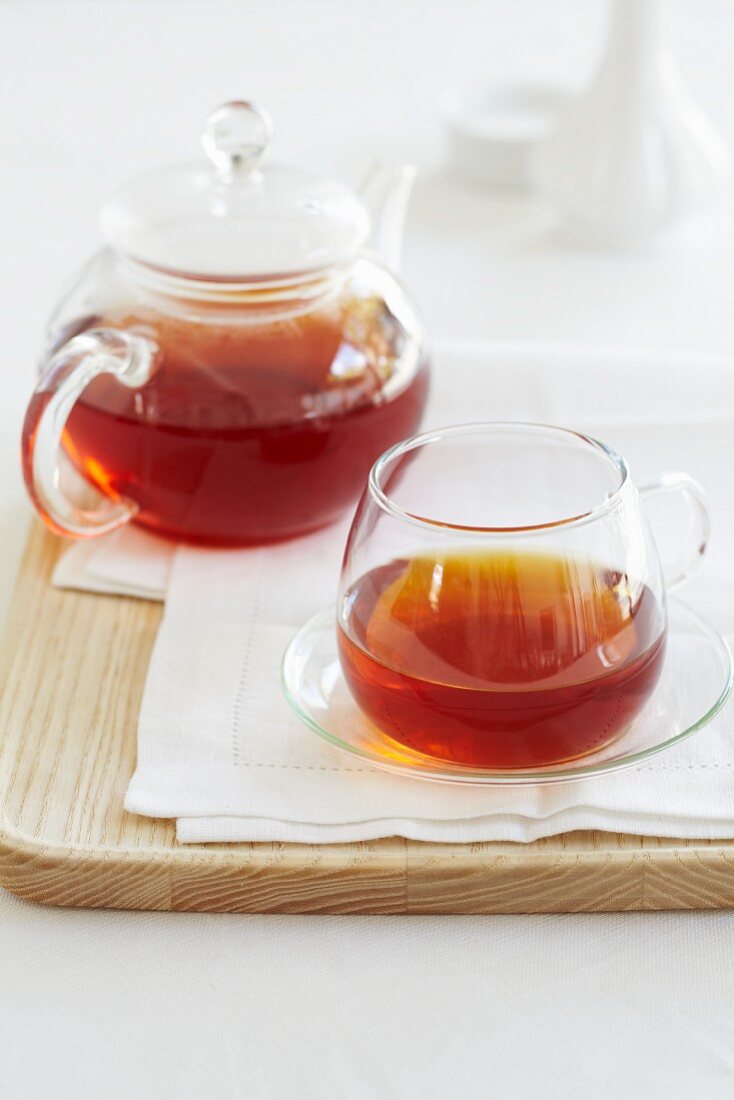 Redbush tea in a glass teapot and a cup