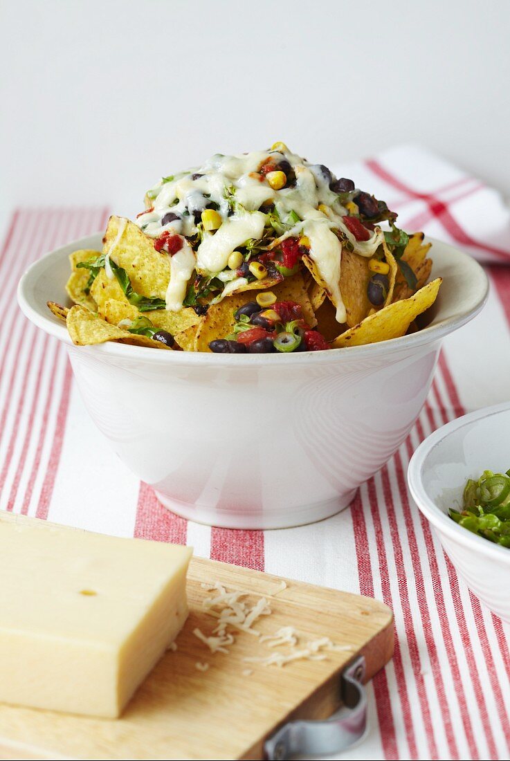 Tortilla chips with black beans, sweetcorn and melted cheese