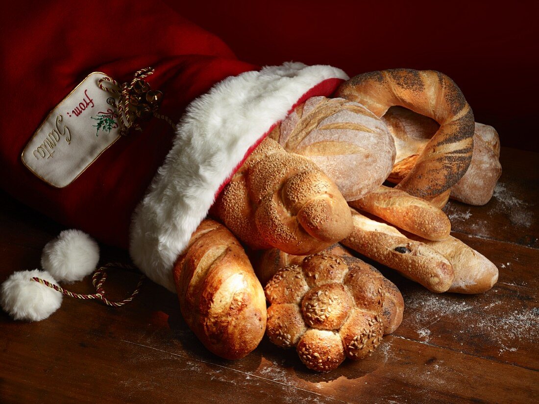 Various types of bread and bread rolls in a Christmas stocking