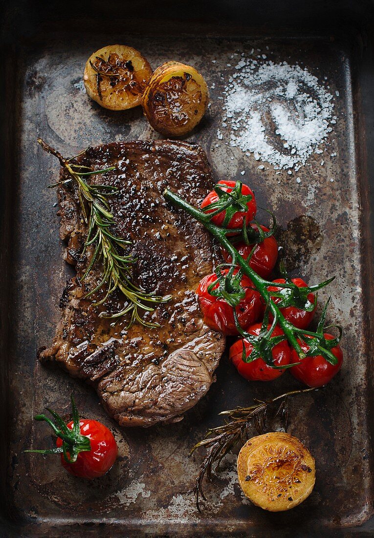 Beef steak with tomatoes and rosemary