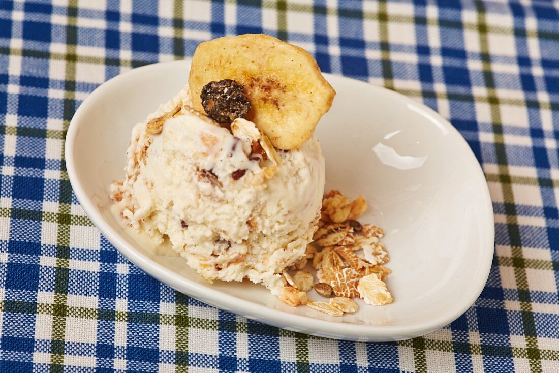 A scoop of homemade muesli ice cream with oats and dried fruit