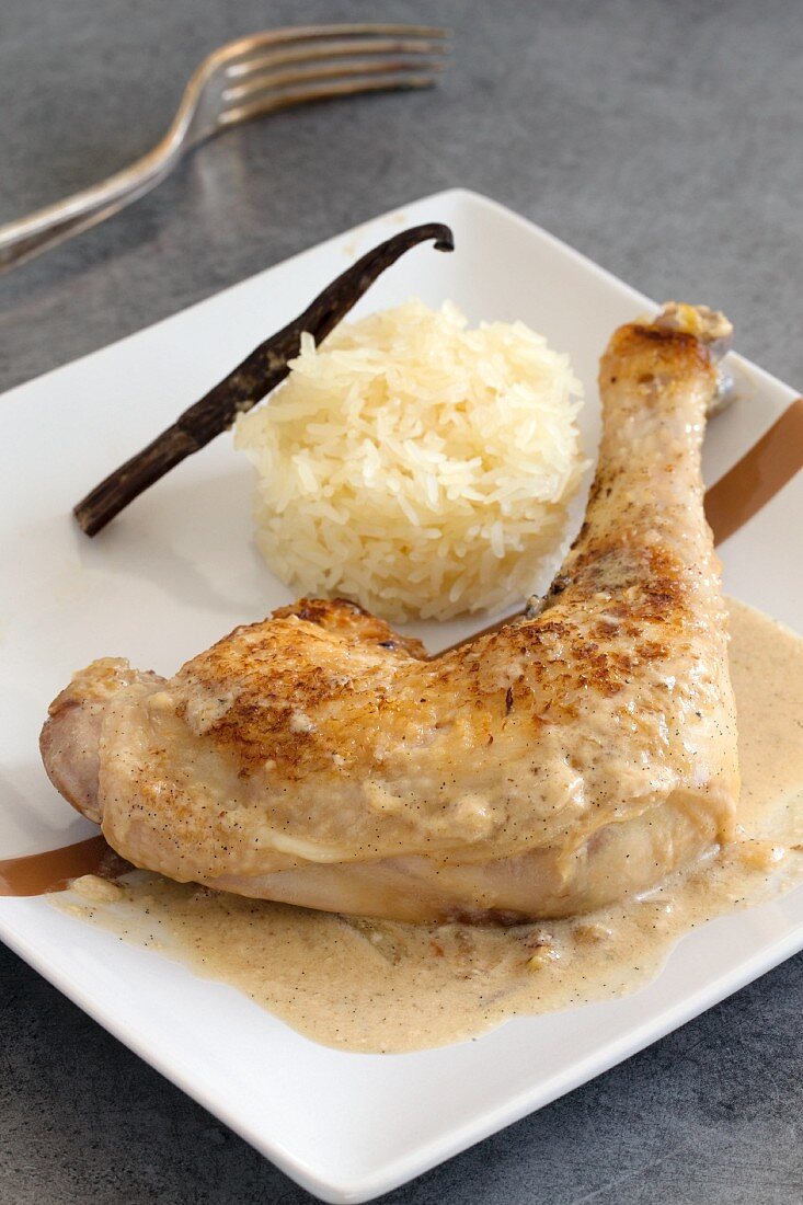 A chicken leg with vanilla sauce and sticky rice
