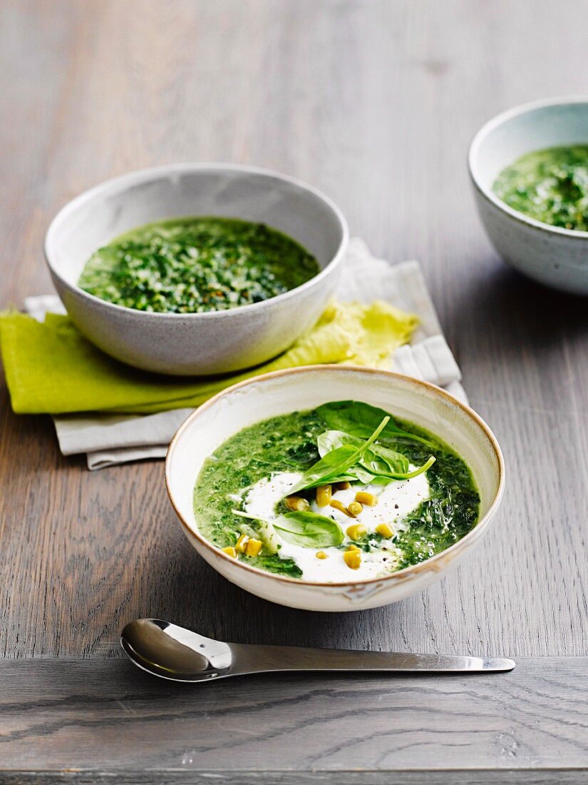 Spinach and quinoa soup with yoghurt and pickled chillies