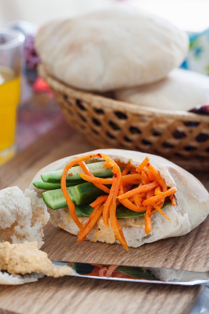 Pita bread stuffed with carrots and cucumber