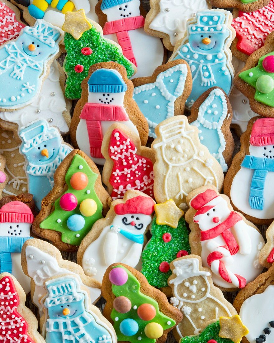 A selection of Christmas biscuits decorated with icing sugar