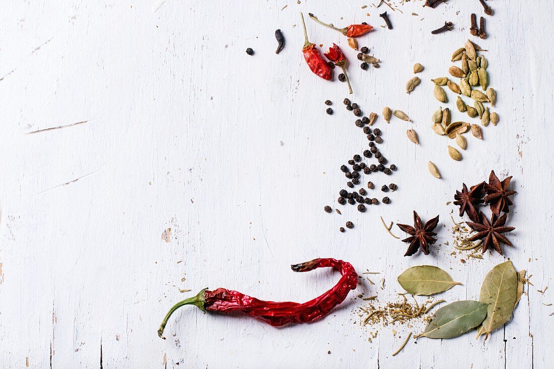 Various spices on a white surface