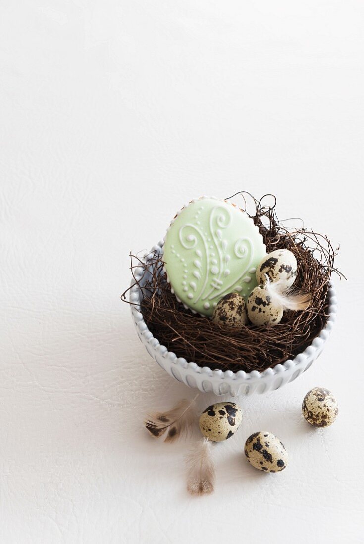 Easter biscuits and quail's eggs in an Easter nest