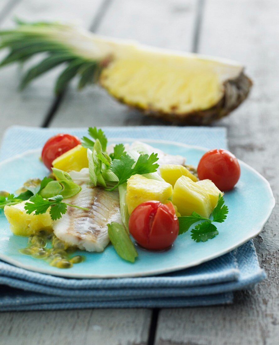 Fish fillet with pineapple and cherry tomatoes