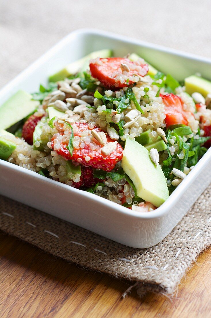 Quinoa and strawberry salad with spinach and avocado