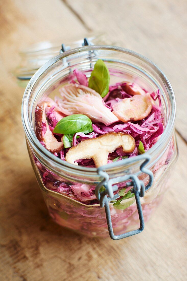Red cabbage salad with mushrooms and the yoghurt dressing in preserving jar