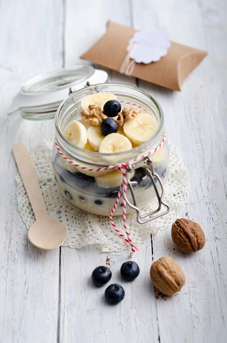 Breakfast with porridge, banana and blueberries