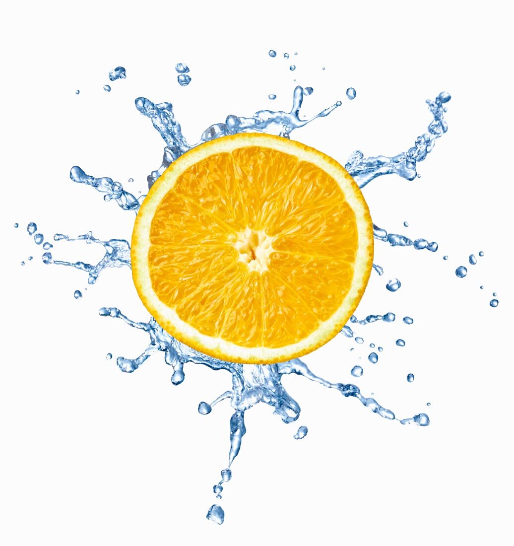 A slice of orange with a splash of water