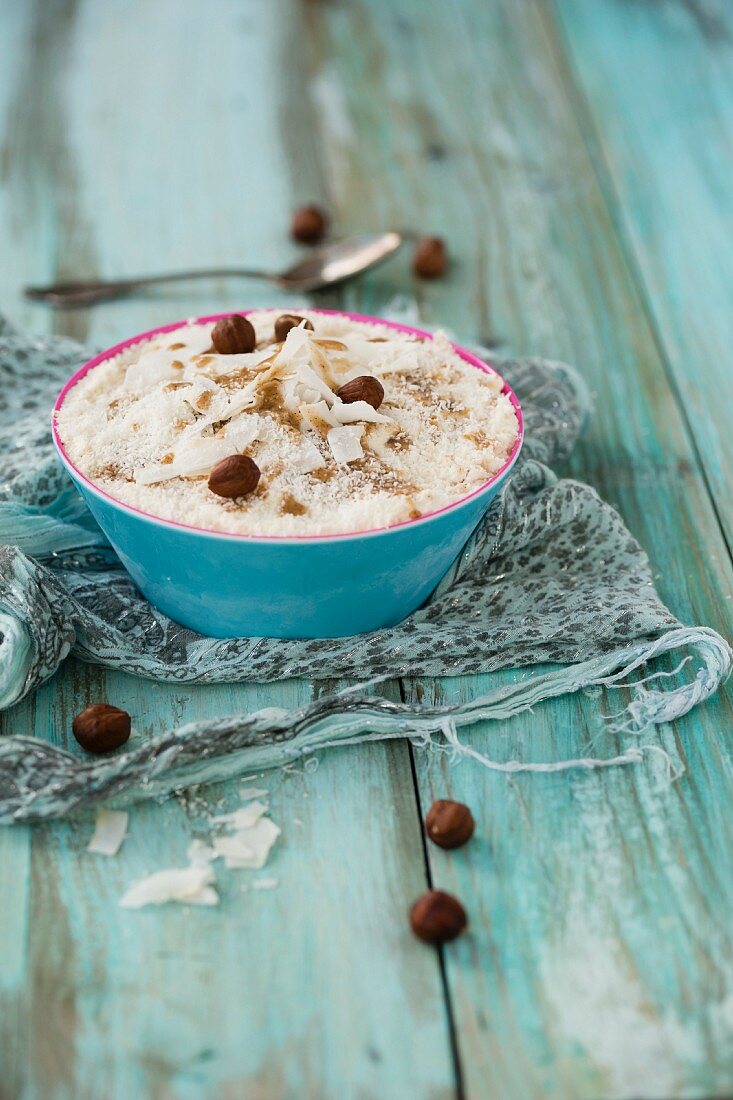 Coconut ice cream with hazelnut mousse and whole whole hazelnuts