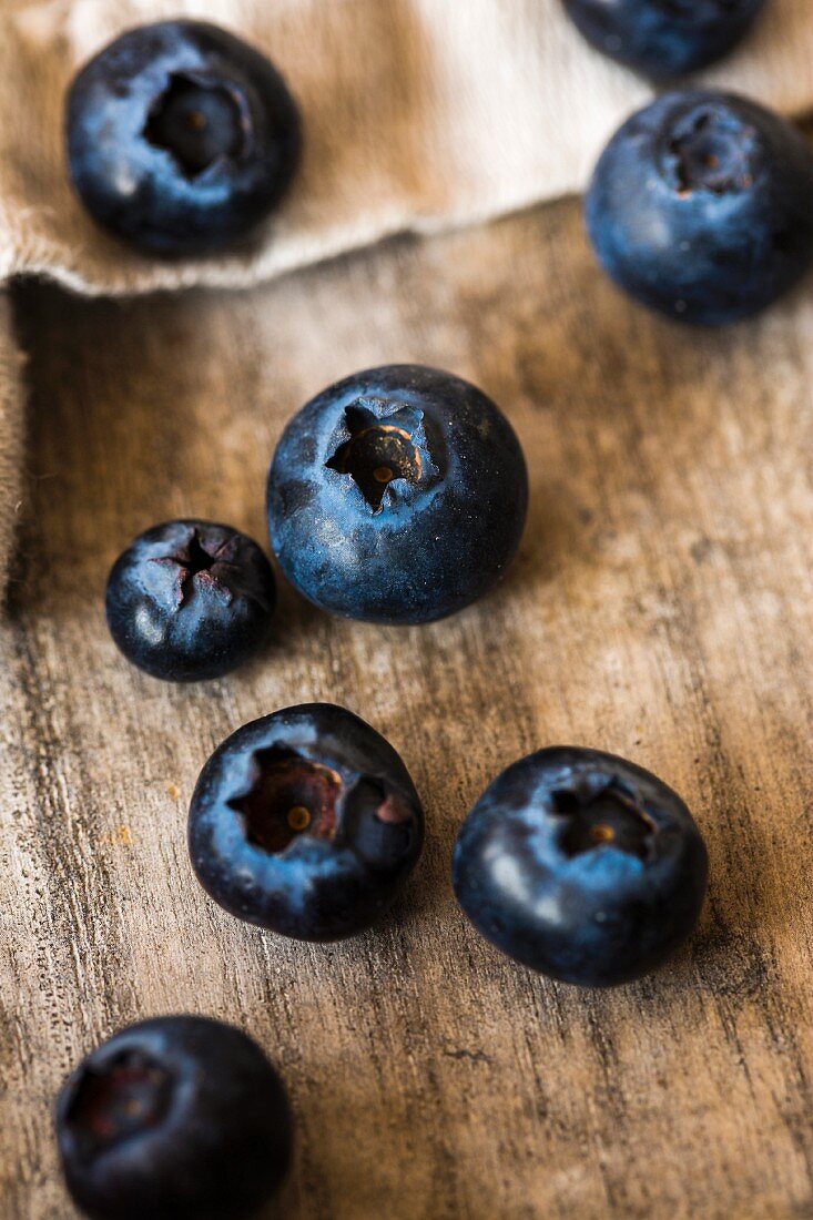 Blueberries on a wooden surface (close-up)