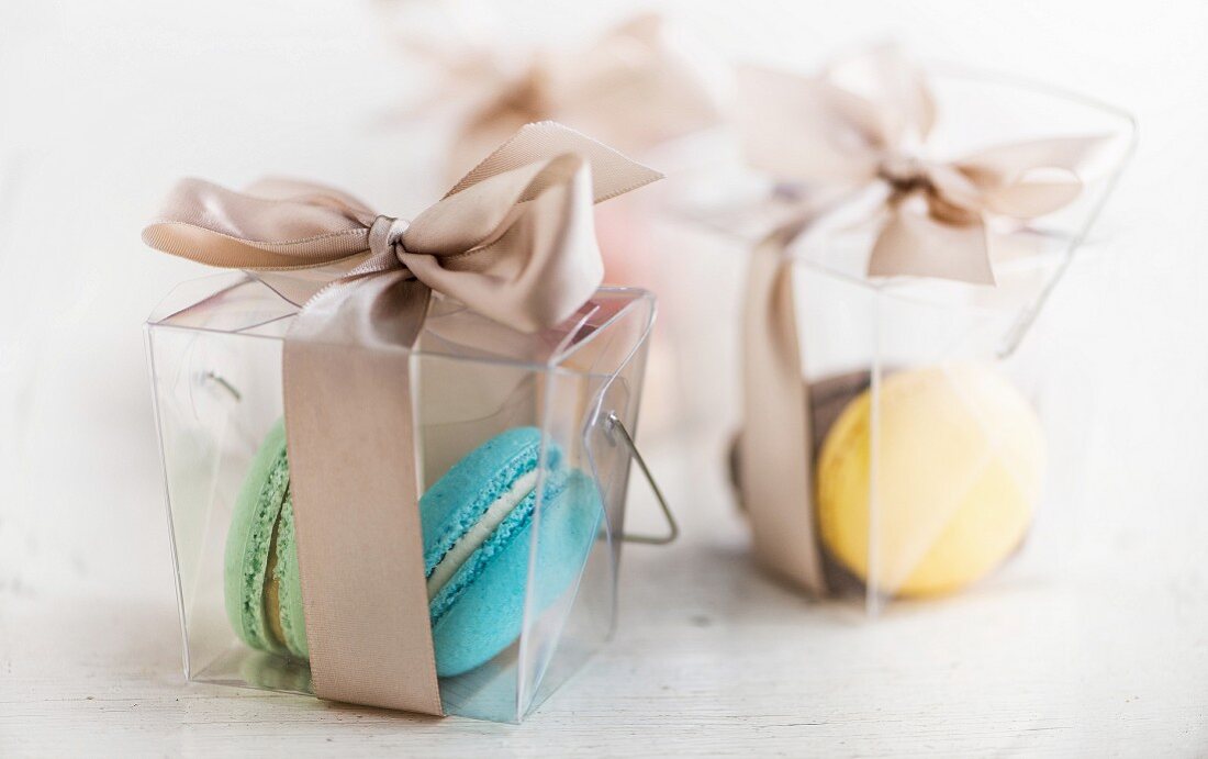 Macaroons in transparent gift boxes