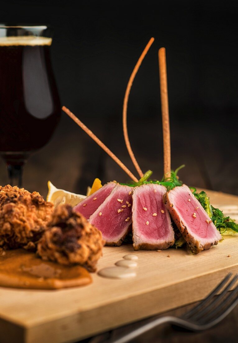 Deep-fried cod fritters and tuna tataki with Japanese dressing and wakame