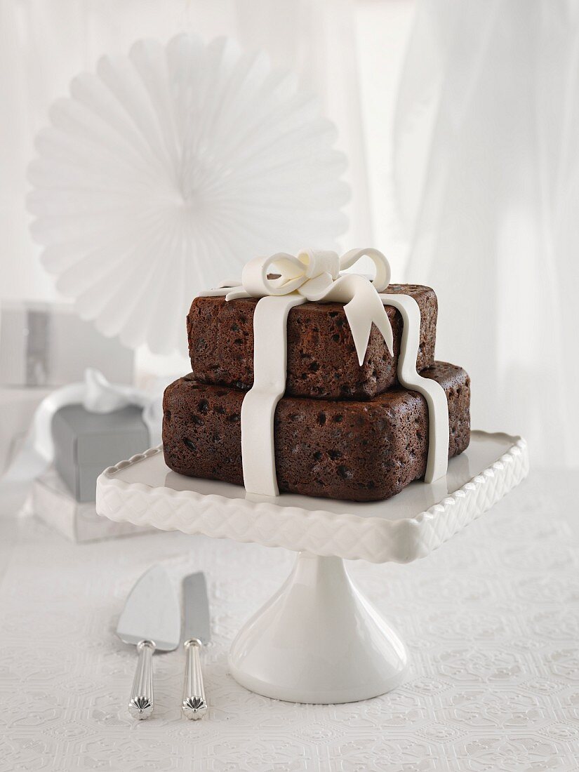 A chocolate wedding cake with a fondant bow