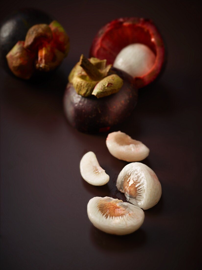 Mangosteens, whole and sliced