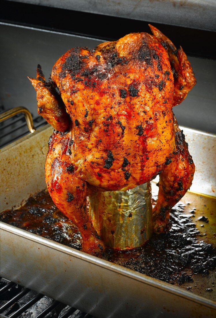 Beer can chicken in an oven