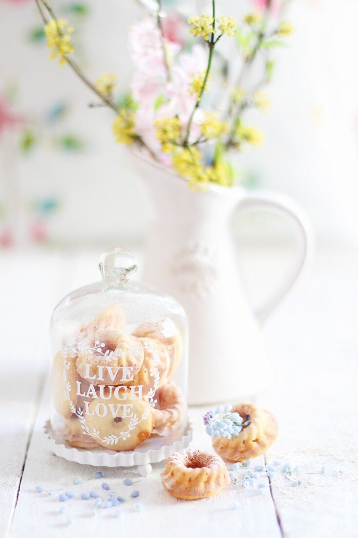 Mini Bundt cakes under a glass cloche