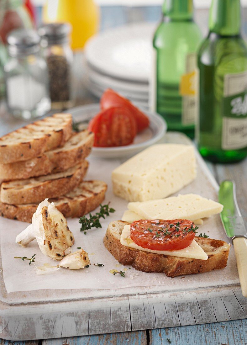 Grilled bread with cheese, garlic and tomatoes