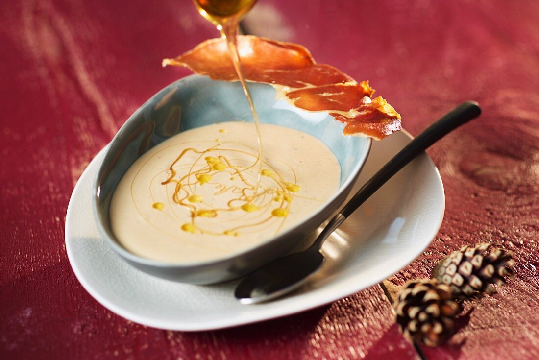 Chestnut and orange soup with a Parma ham crisp and honey