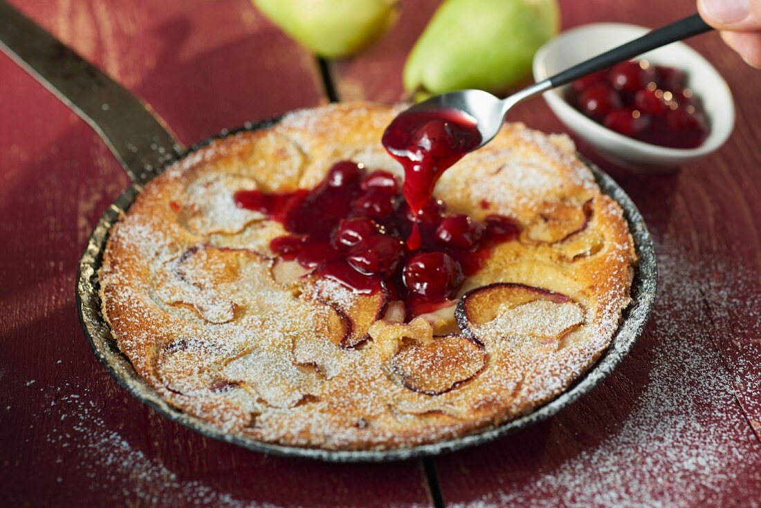 Pear and damson clafoutis with warm Prosecco cherries