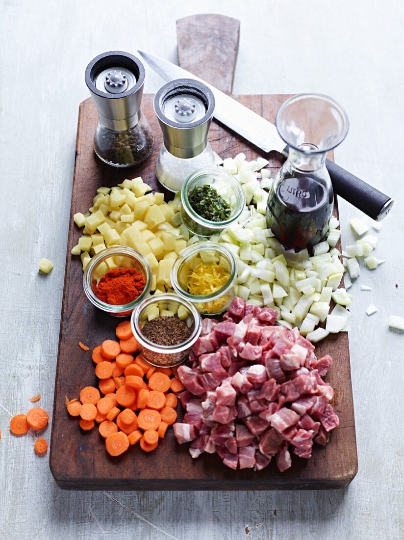 Ingredients for goulash on a chopping board