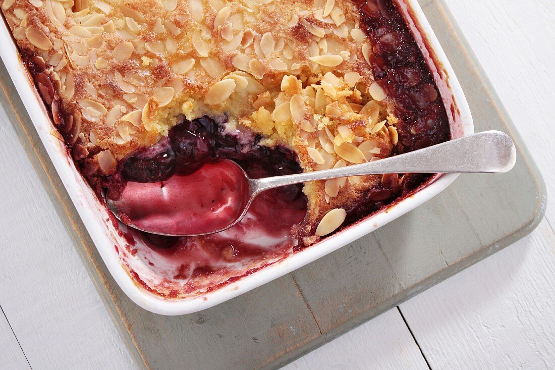 Cherry and almond pudding in a baking dish