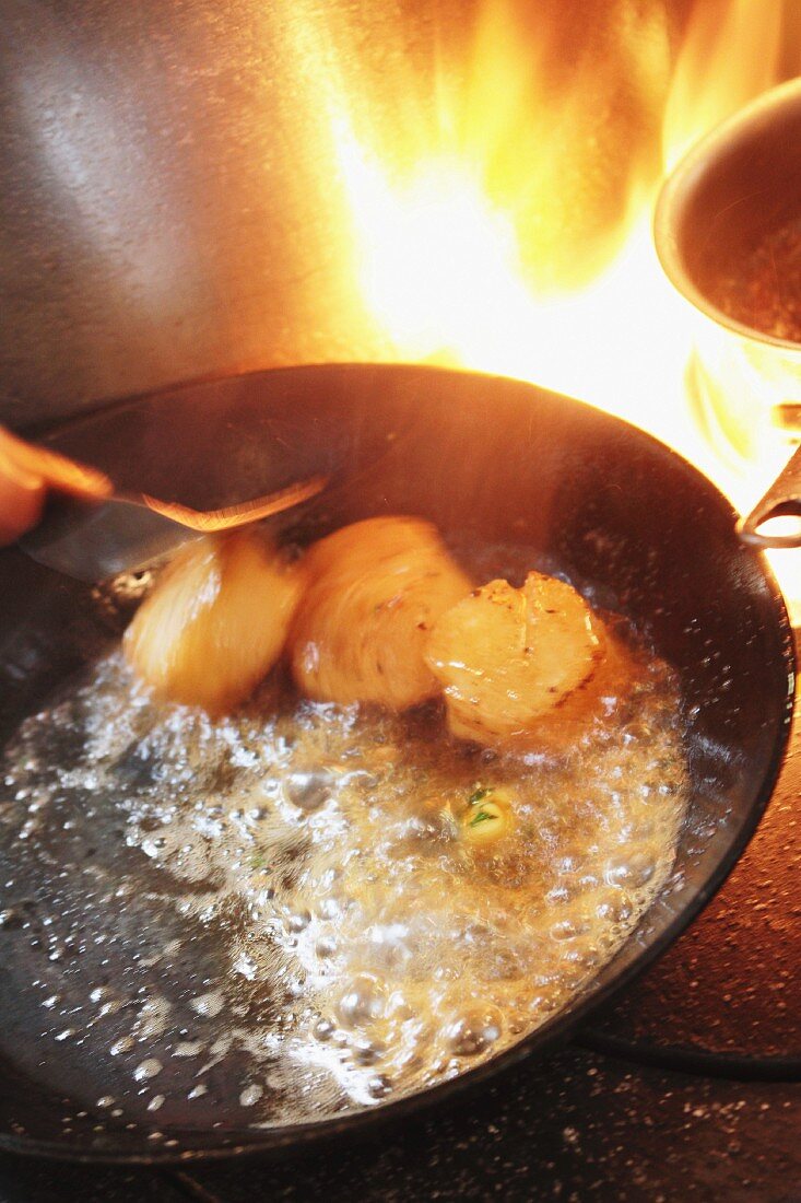 Frying scallops in a pan