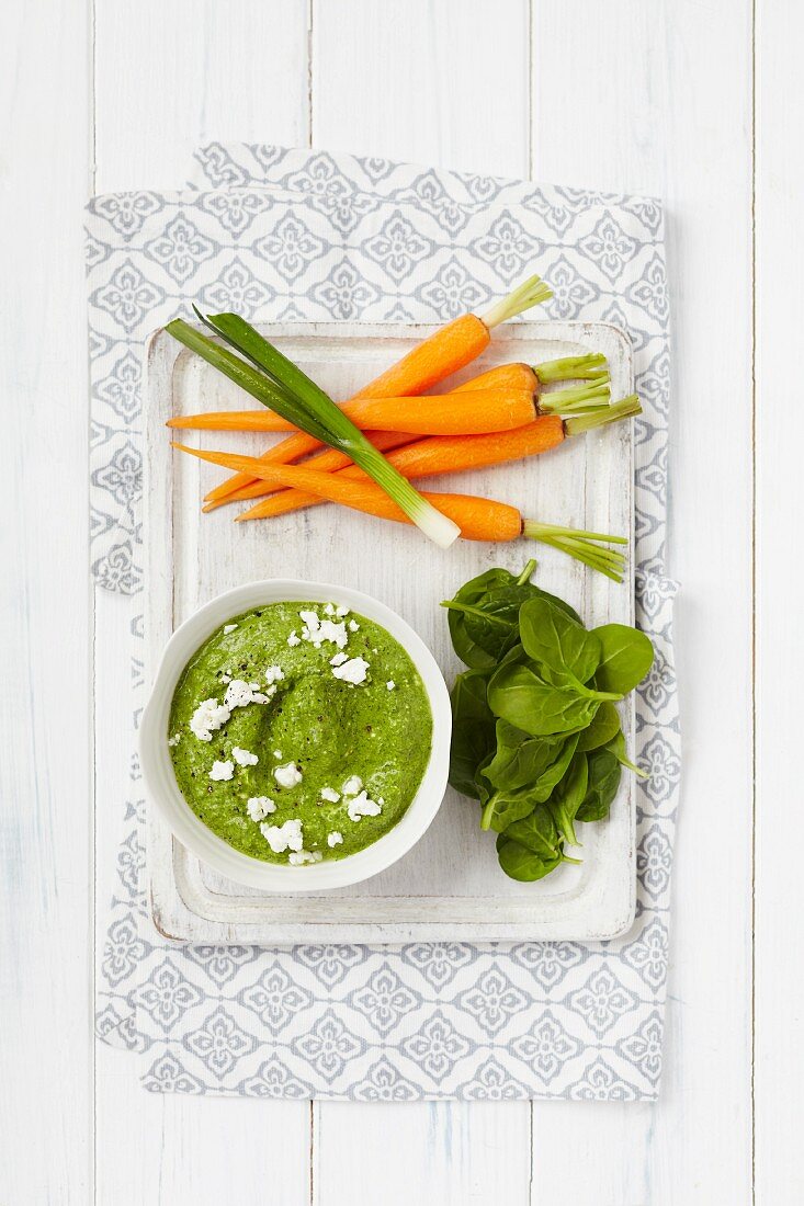 Spinach and spring onion hummus served with carrots