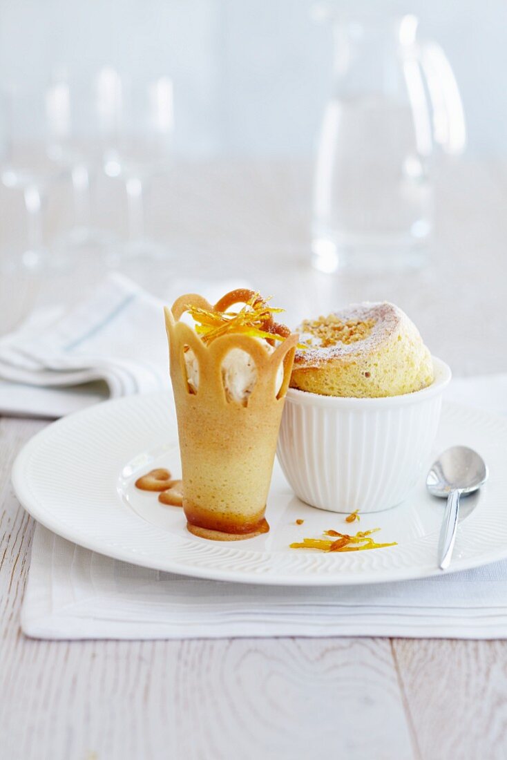 Sponge pudding in a ramekin with a wafer crown filled with ice cream
