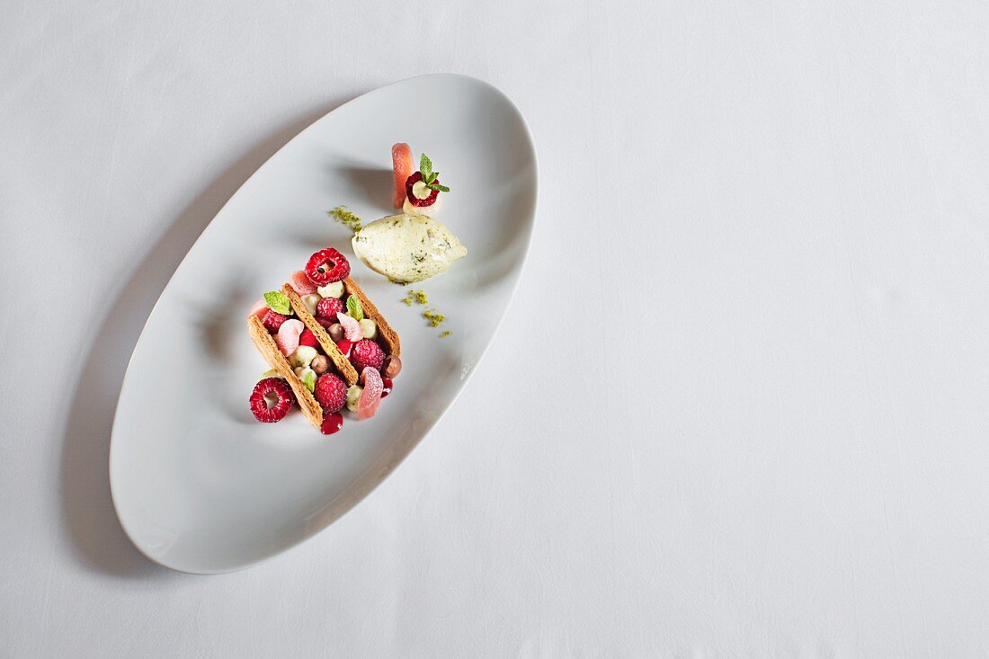 A rhubarb and raspberry mille feuille with pistachio and brittle ice cream