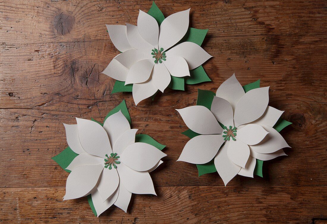 Hand-crafted paper flowers as Christmas decorations