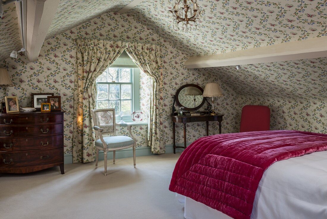 English-style attic bedroom with floral … – License image – 11370817 ❘  Image Professionals