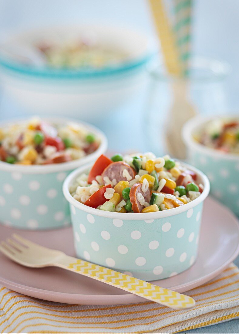 Pasta salad with vegetables and sausages