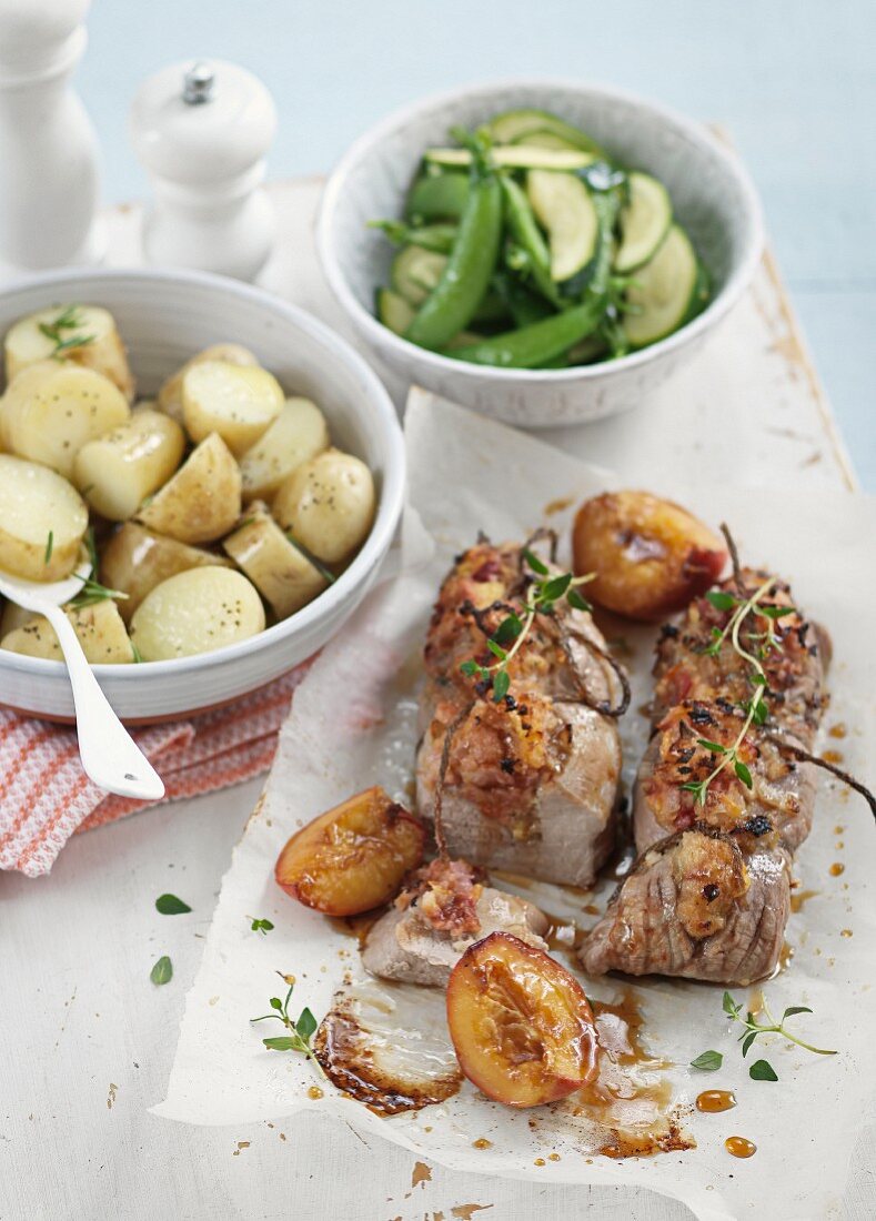 Pork with peaches, potatoes and a side of vegetables