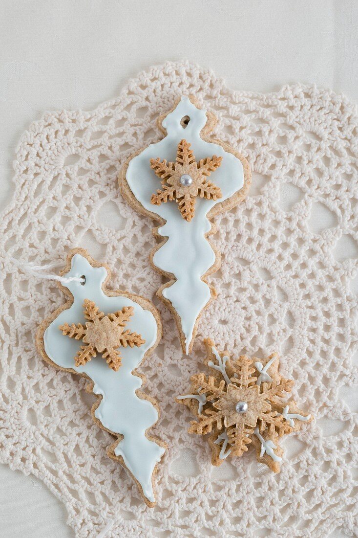 Christmas biscuits for decorating the tree on a crocheted doily