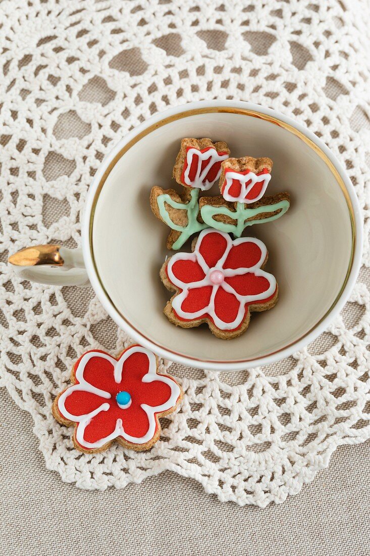 Iced, flower-shaped biscuits in a cup (seen above)