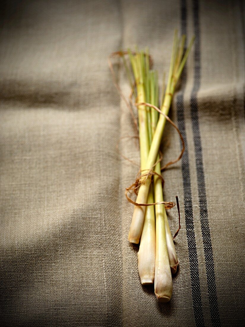 Fresh lemongrass on a linen cloth