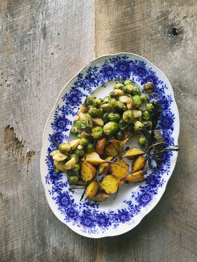 Oven roasted vegetables (brussels sprouts, parsnips, yellow beets), on a serving platter