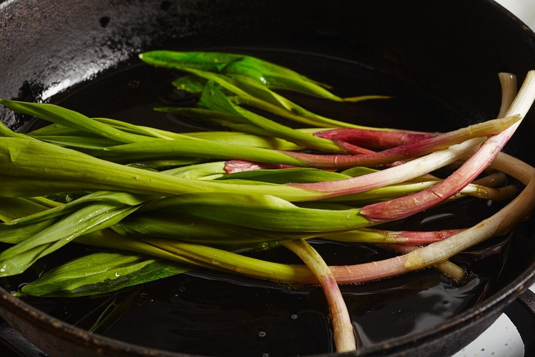 Fried wild leek in a pan