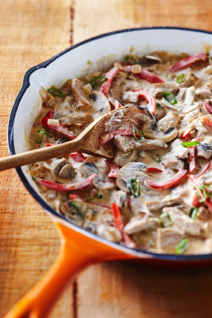 Pork stroganoff with peppers and mushrooms