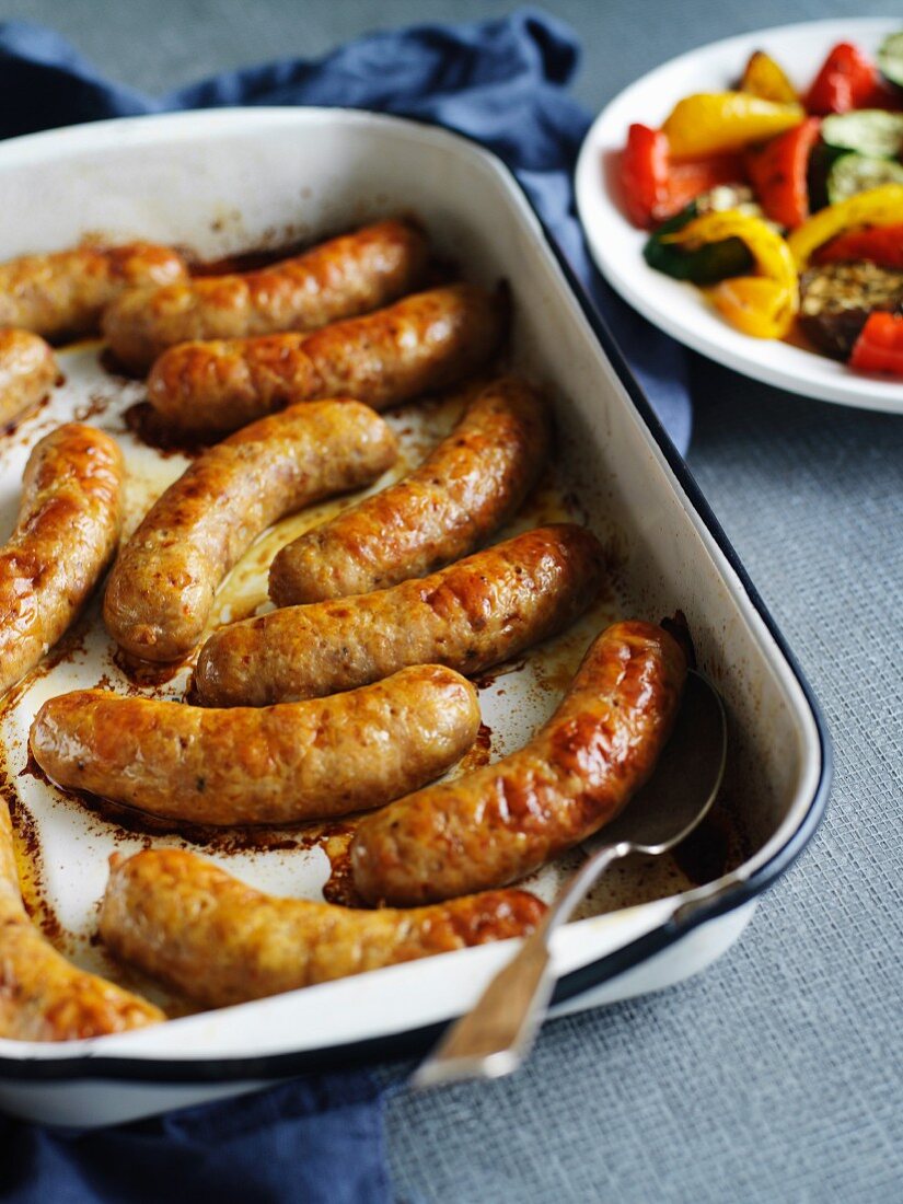 Sausages and a plate of vegetables