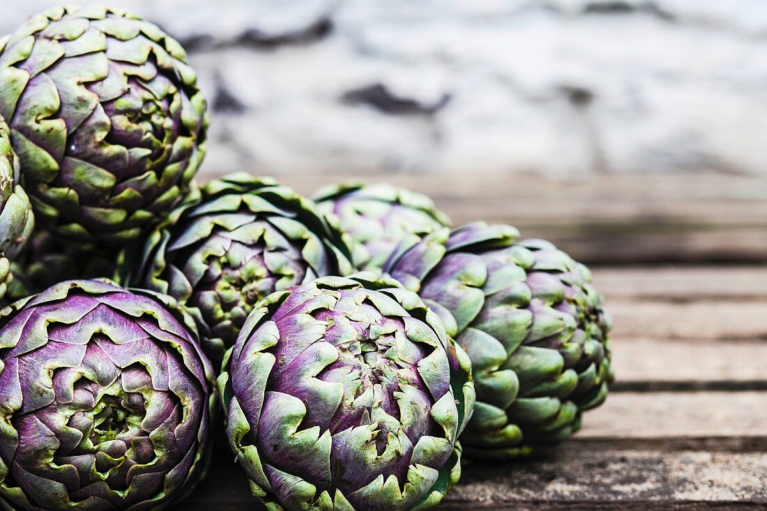 Artichokes on a wooden table