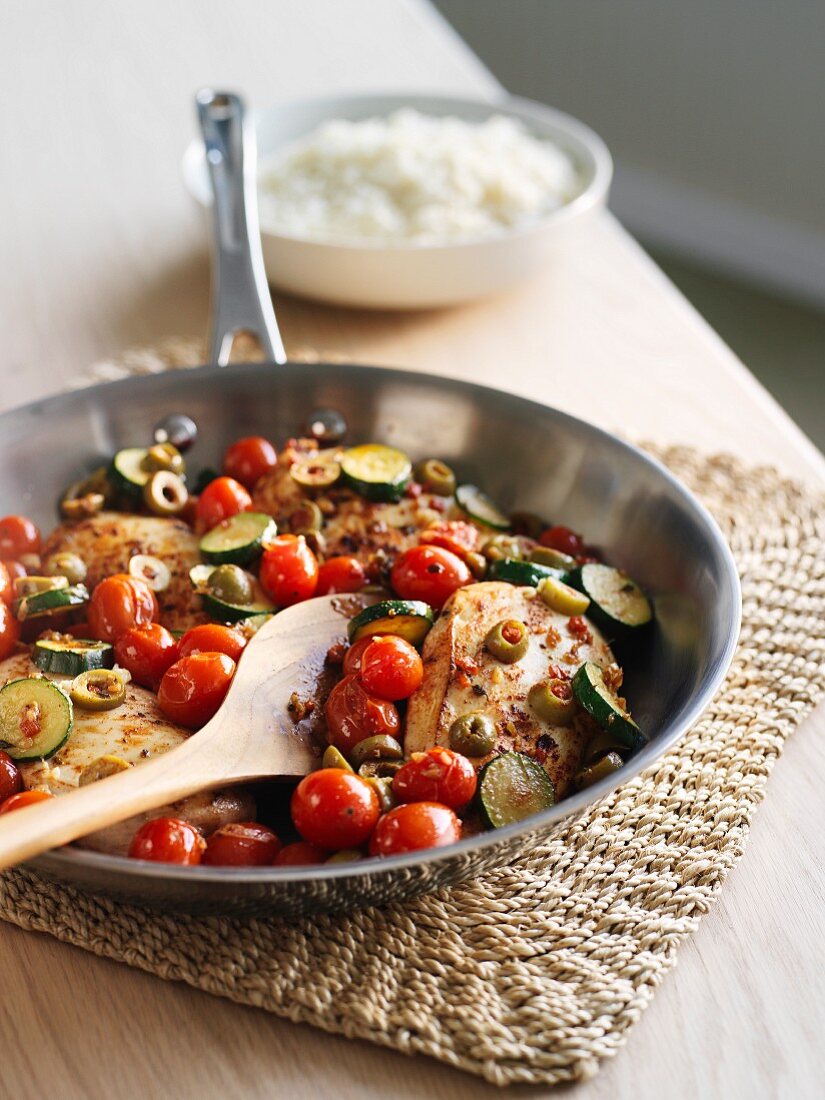 Chicken with green olives, courgette and cherry tomatoes