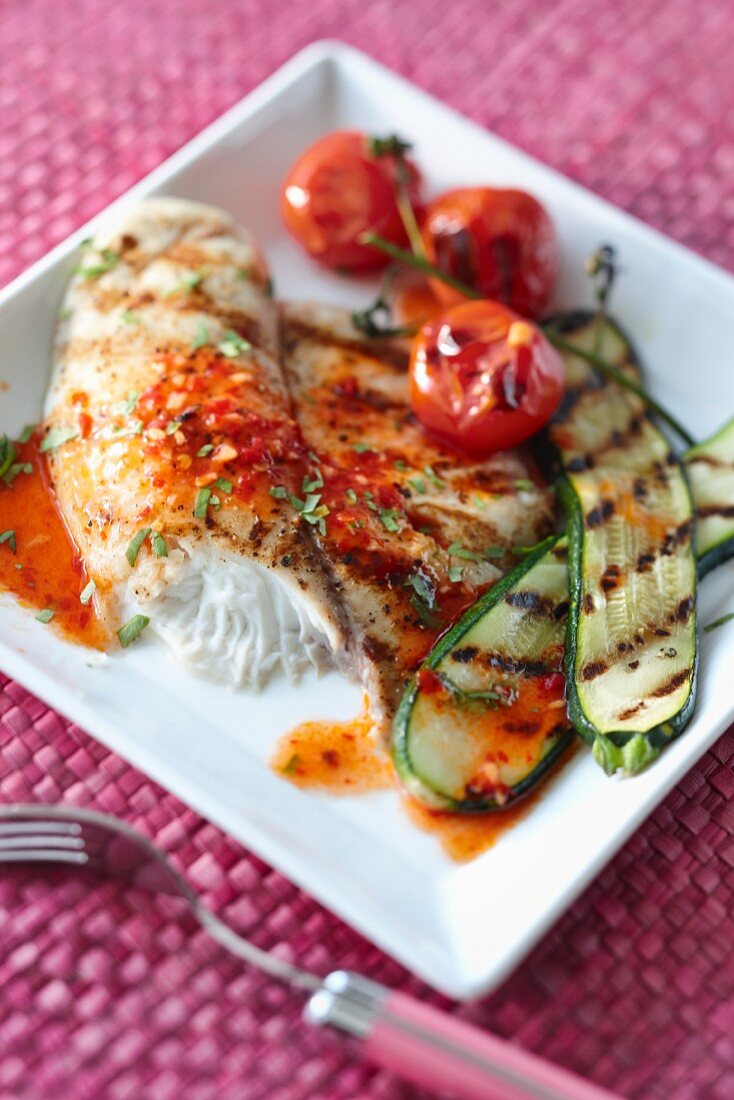 Grilled fish with a chilli and lime sauce and grilled vegetables