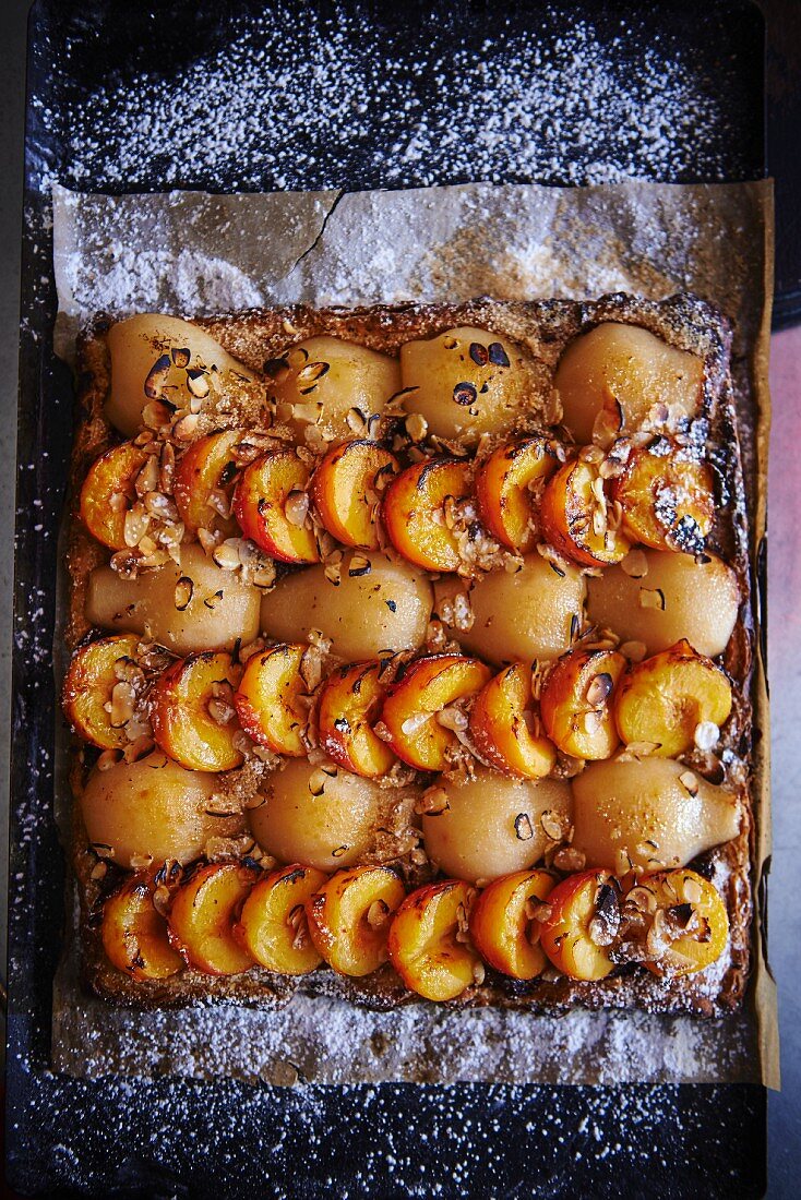 Pear and apricot tart with chopped nuts